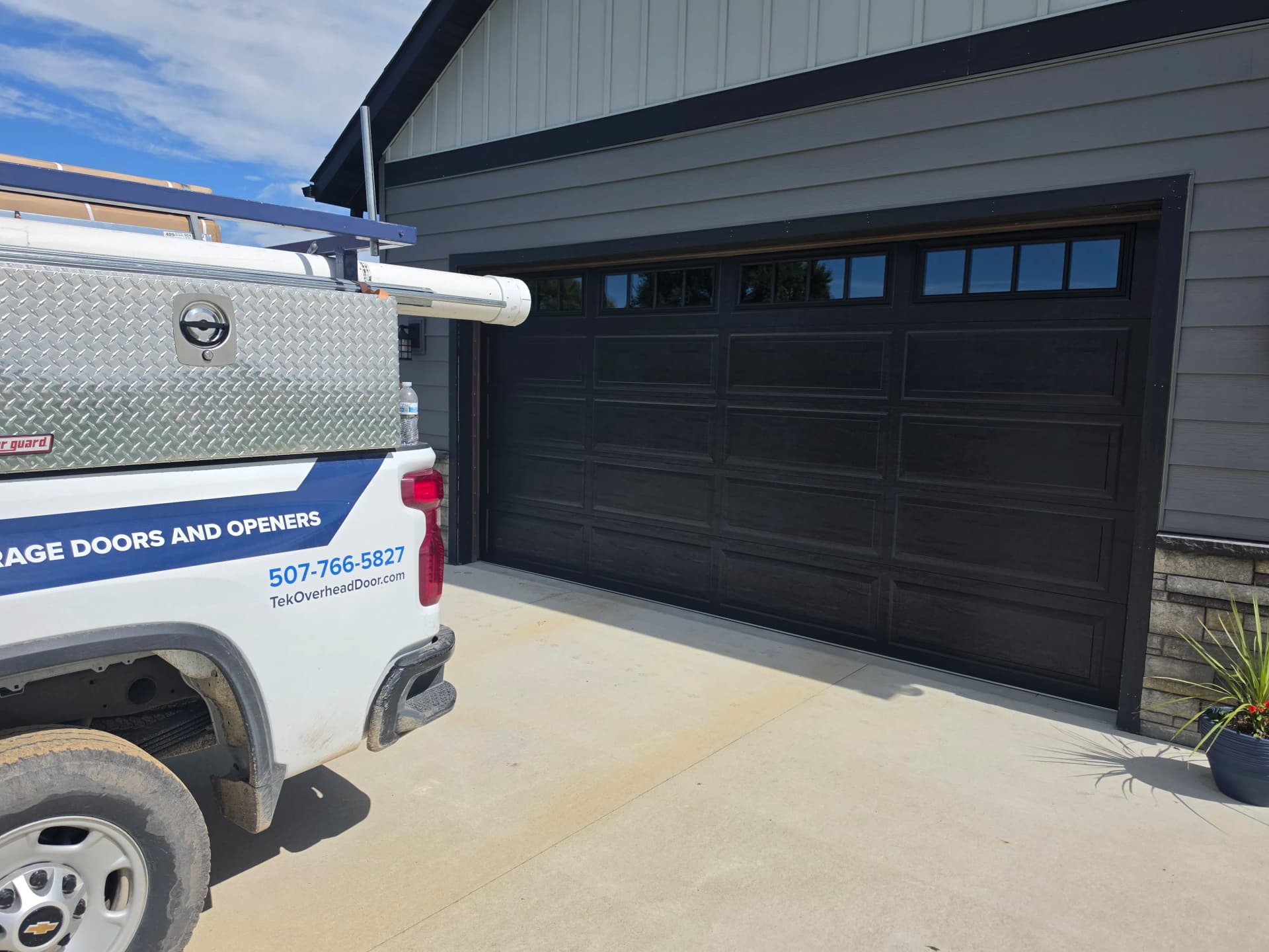 Gallery photos for Black Long Raised Panel Door with Commercial Opener Install: Image #2