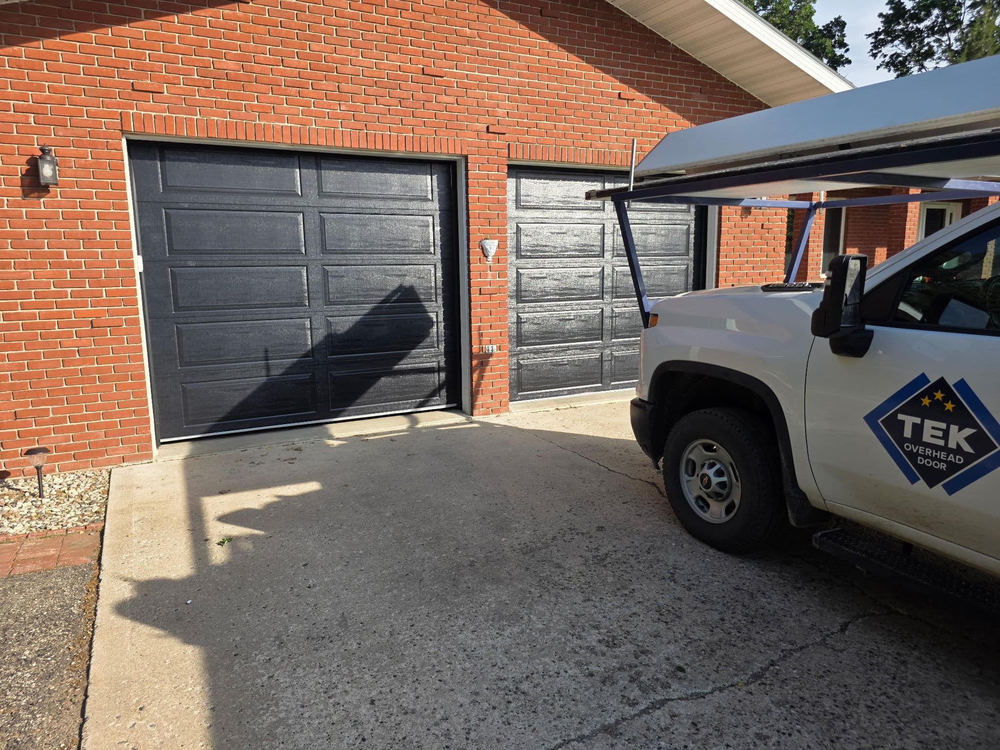 Project Dual Black AP138 Garage Door Installation on a Raised Ranch image