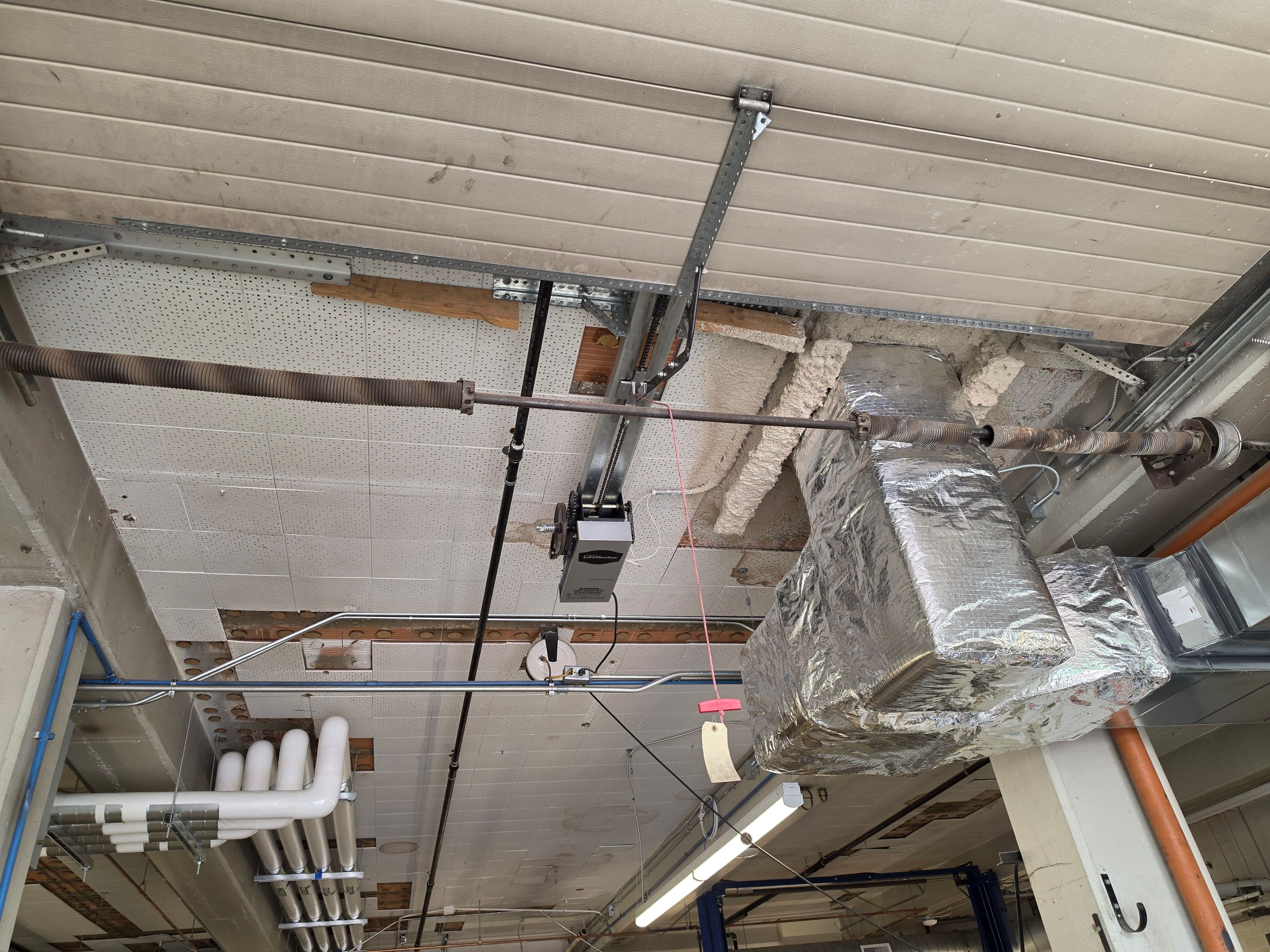 Project Commercial Garage Door Opener and Spring Install in a Tight Overhead Space image