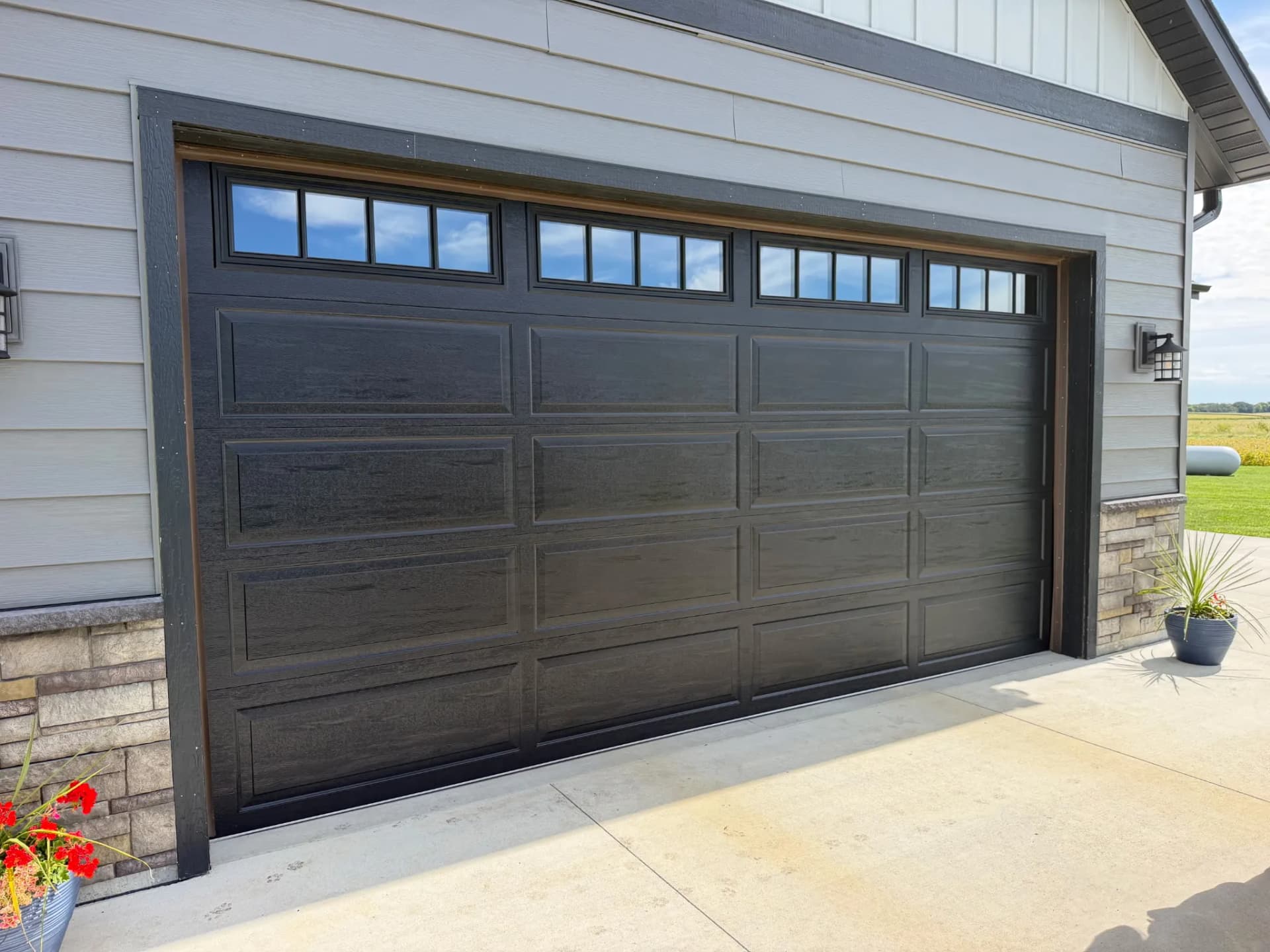 Black Long Raised Panel Door with Commercial Opener Install image