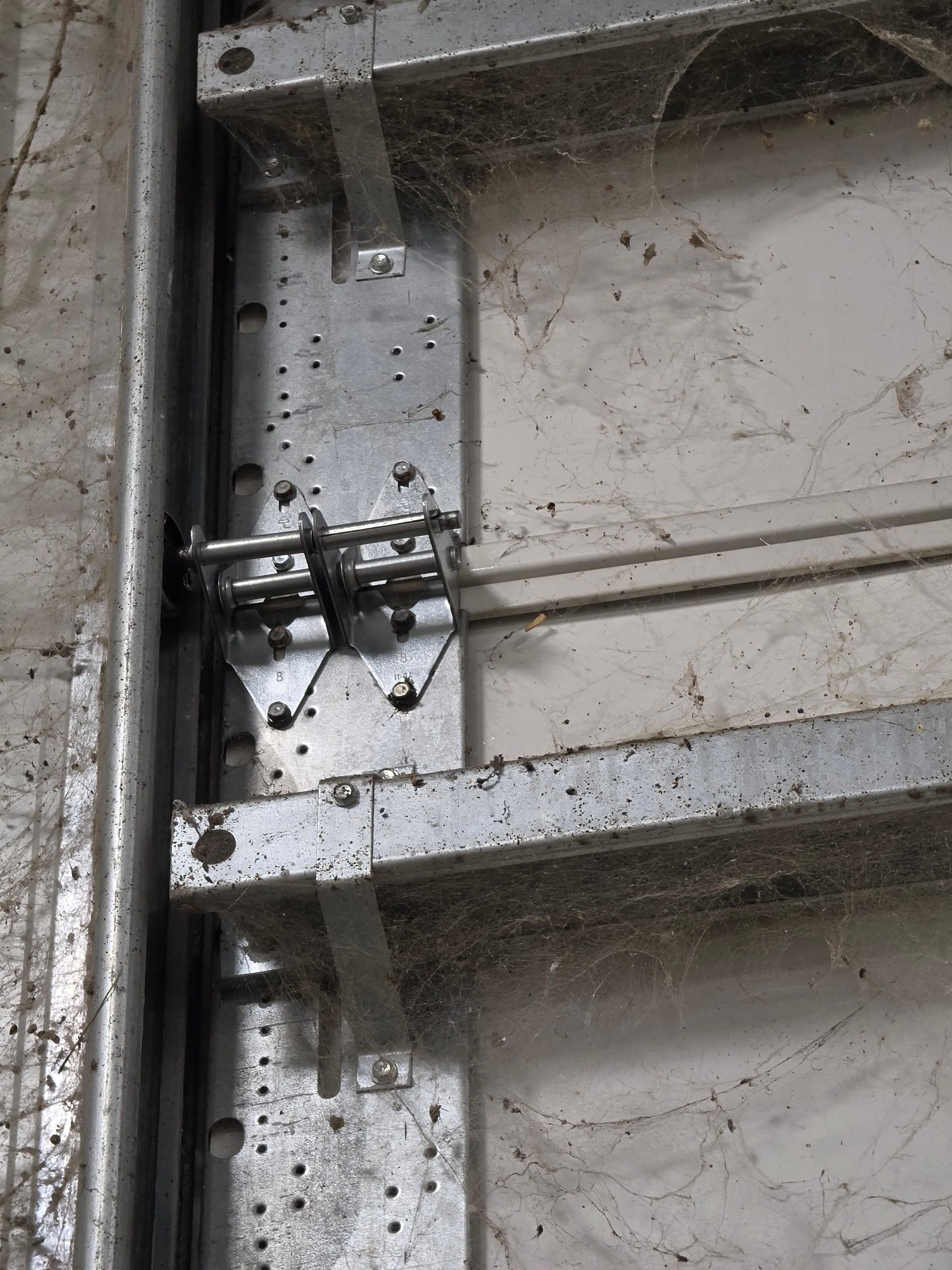 A Broken Hinge Can Take Down Your Whole Garage Door System image