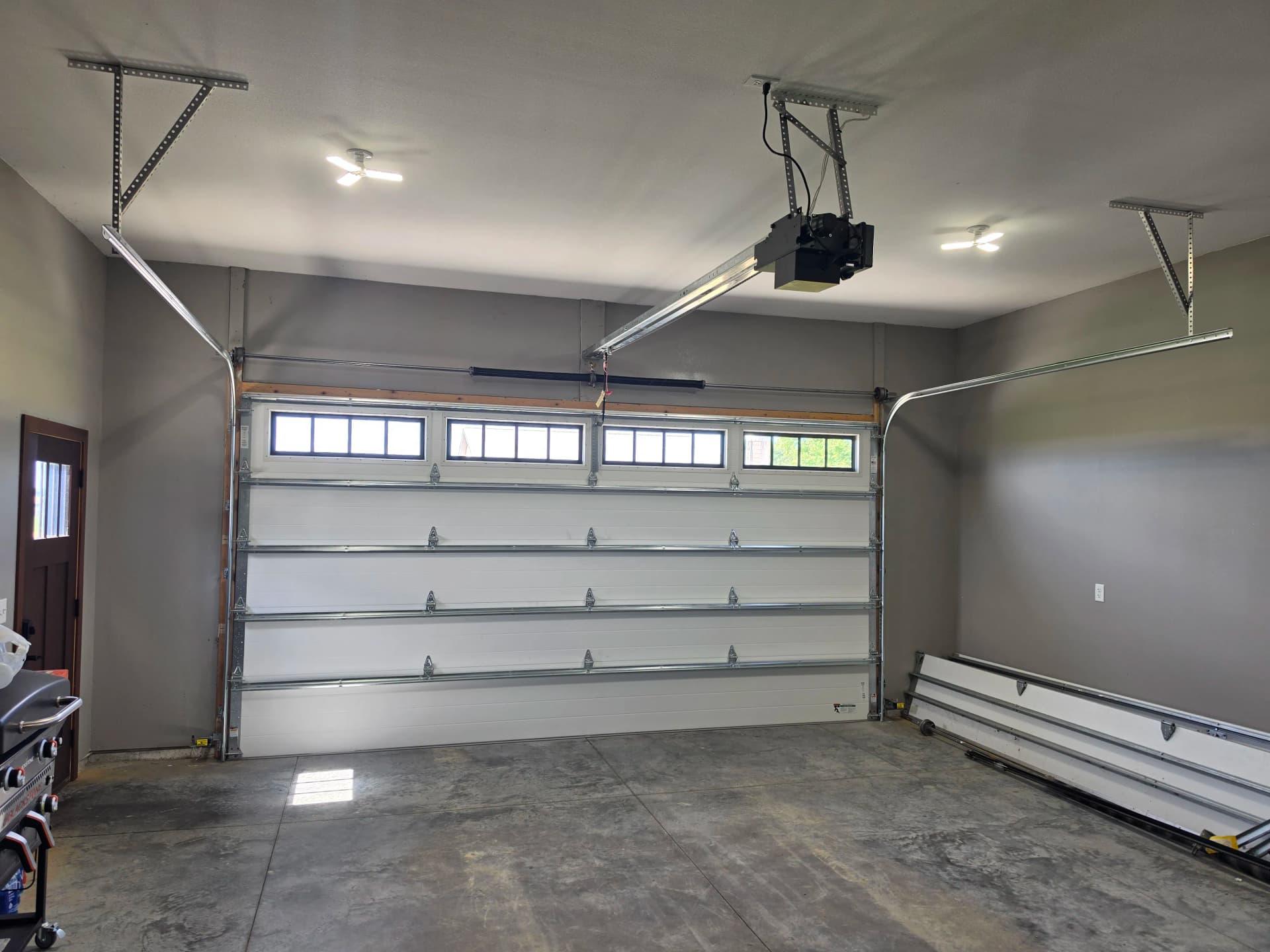Gallery photos for Black Long Raised Panel Door with Commercial Opener Install: Image #4