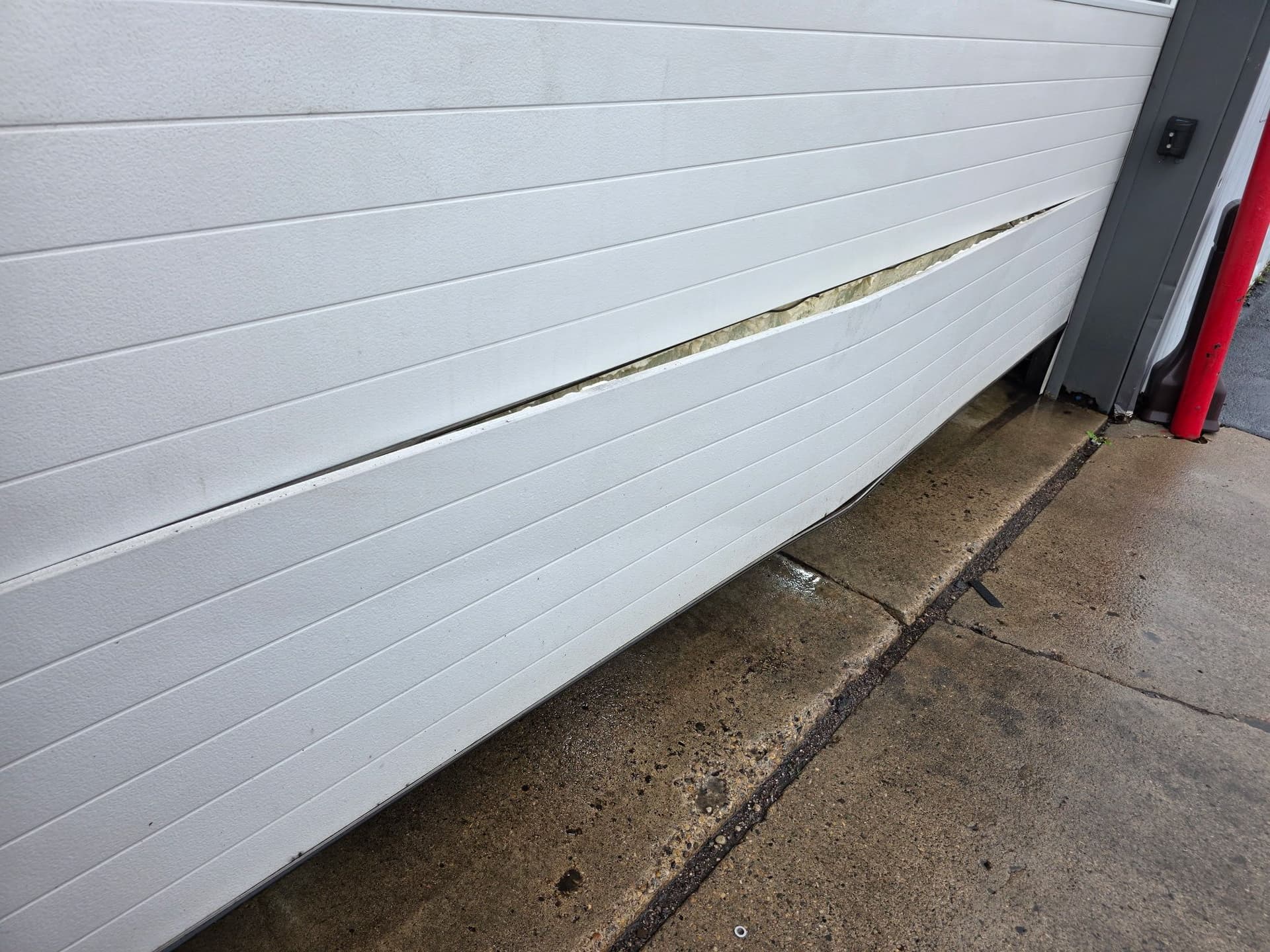 Car Hit This Garage Door - Here's What a Temporary Fix Looks Like image