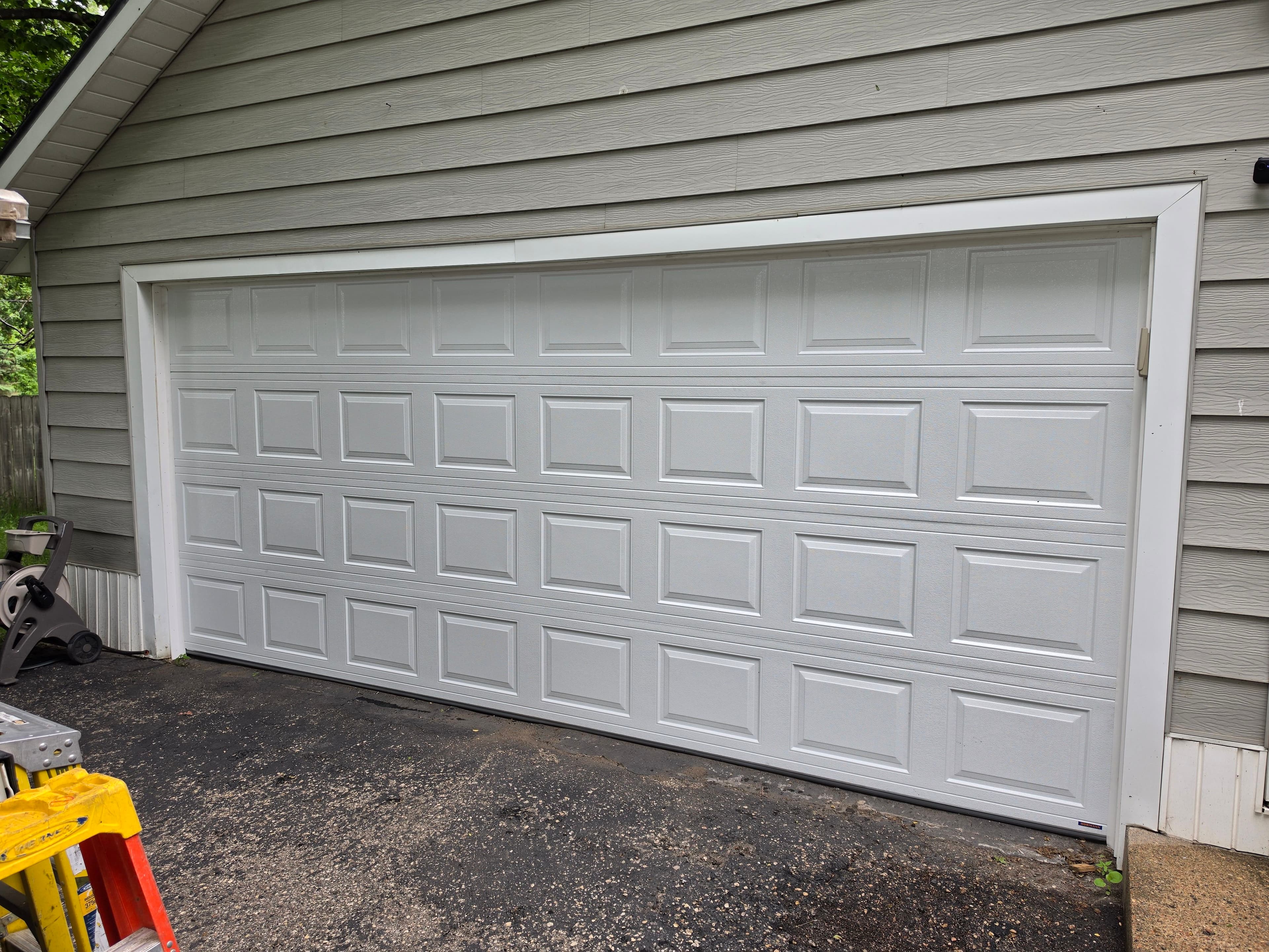 Project Fresh Garage Door Installation with a Classic White Panel Design image