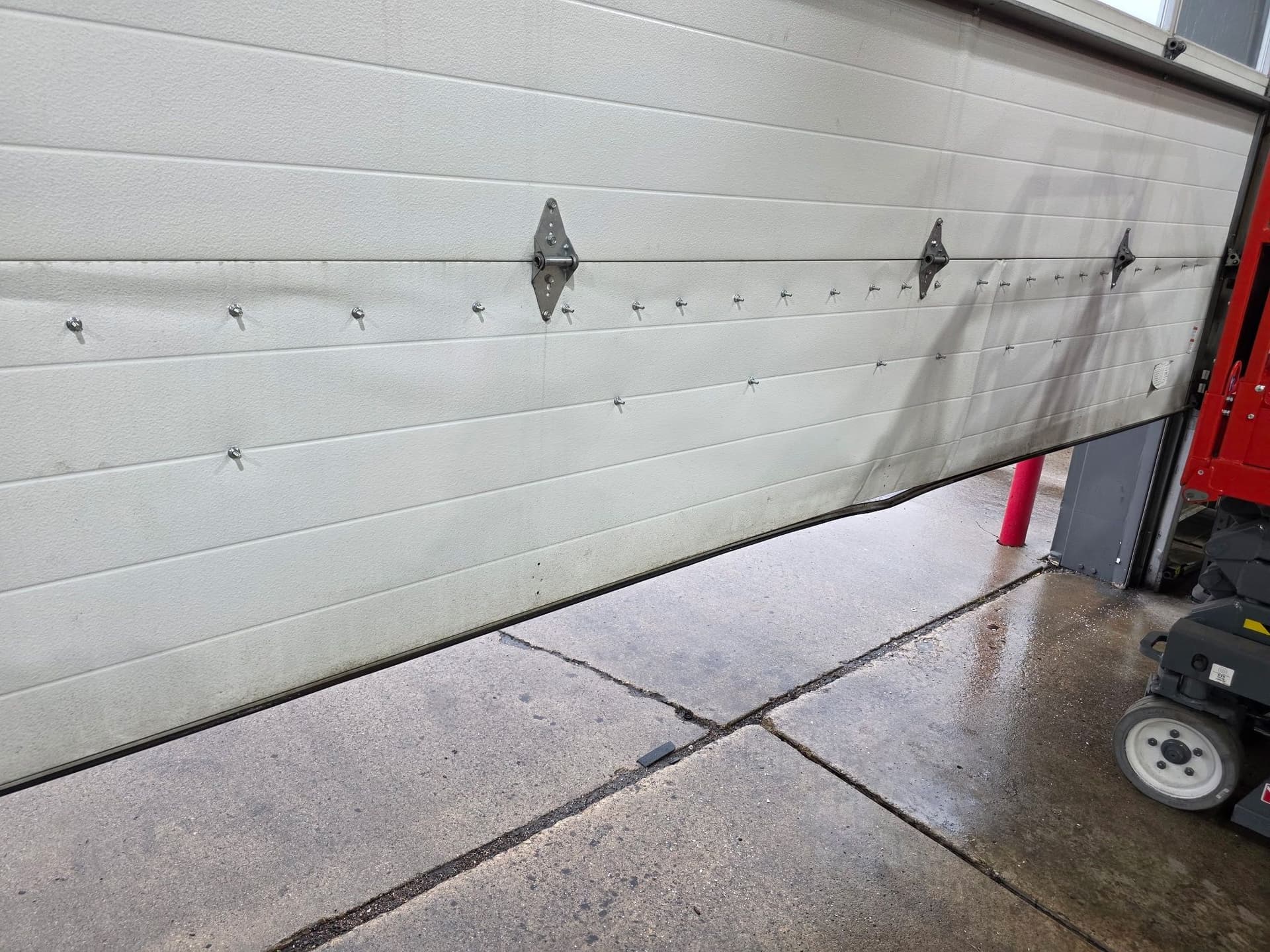 Gallery photos for Car Hit This Garage Door - Here's What a Temporary Fix Looks Like: Image #1