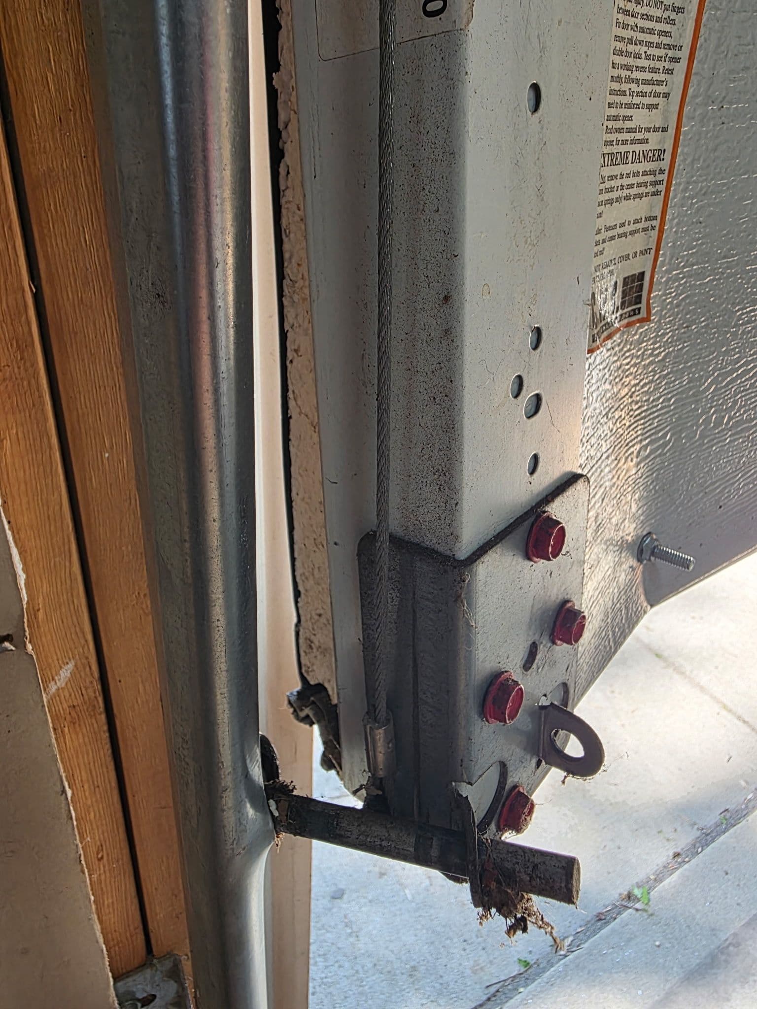 What a Hit Garage Door Actually Does to Your Hardware image