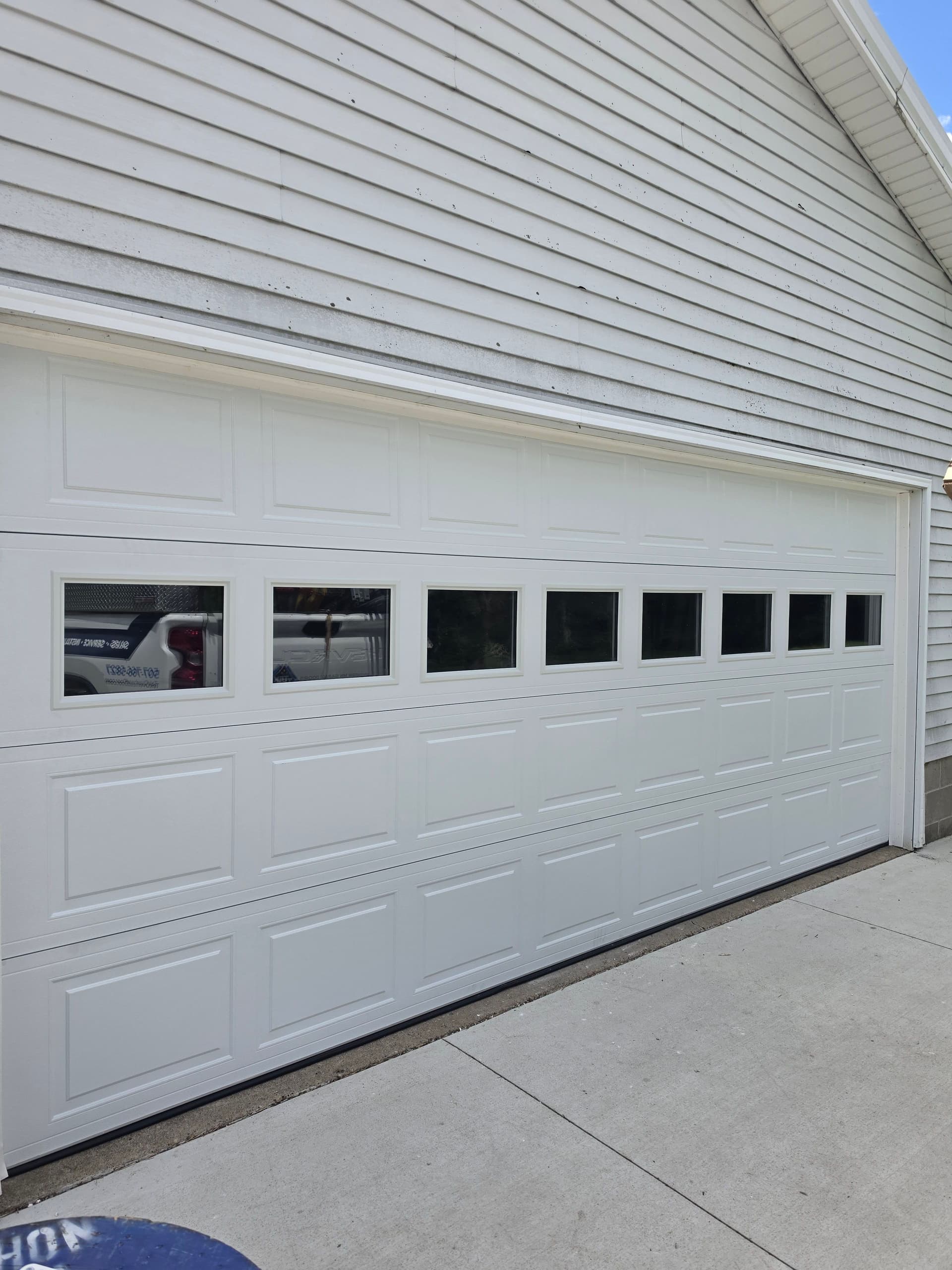 A 16x7 Garage Door with Windows That Actually Changes How the Space Feels image
