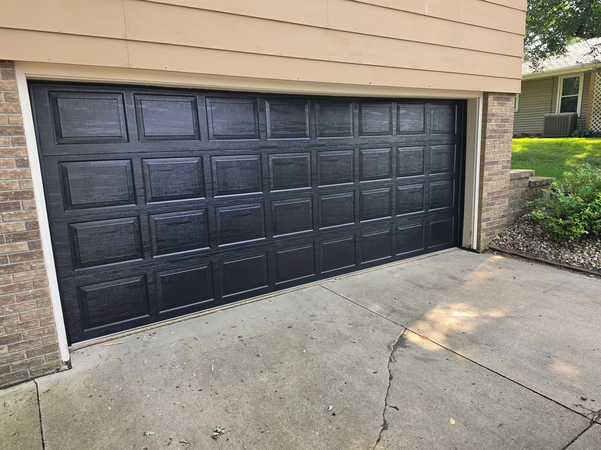 Black AP200 Garage Door Installation That Nails Curb Appeal image